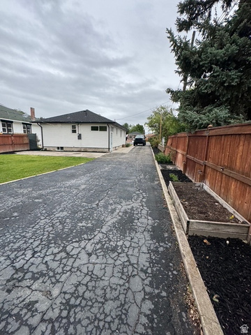 189 West Center Street Midvale, UT 84047 - Photo 57 of 64 Long asphalt driveway providing extensive off-street parking
