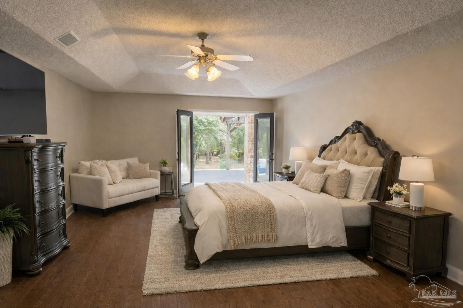 3055 Wallace Lake Road Pace, FL 32571 - Photo 23 of 33 a bedroom with bed and a chandelier