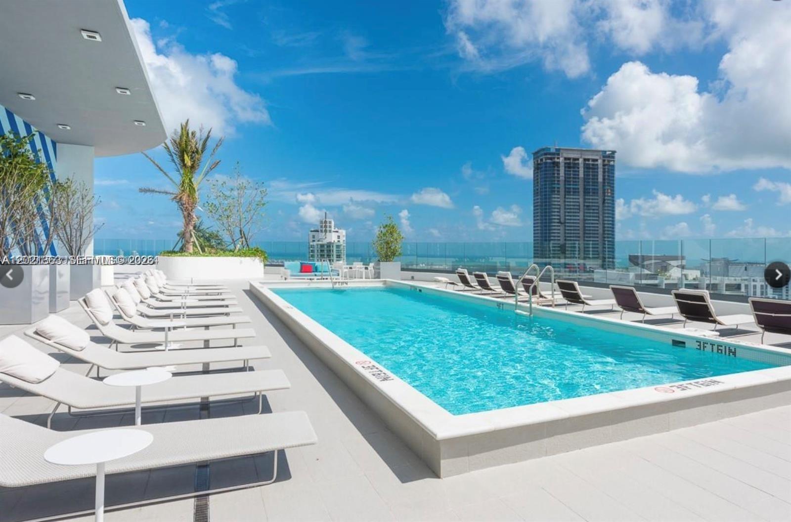 45 Southwest 9th Street, Unit 3107 Miami, FL 33130 - Photo 9 of 12 a view of swimming pool with a yard
