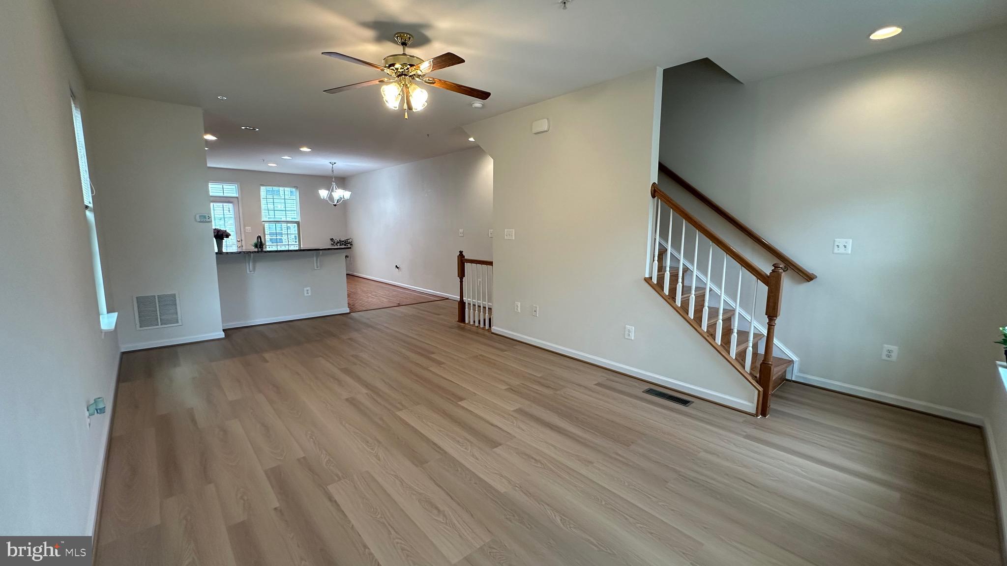 7343 Old Calvary Road Hanover, MD 21076 - Photo 19 of 35 wooden floor in an empty room with a window