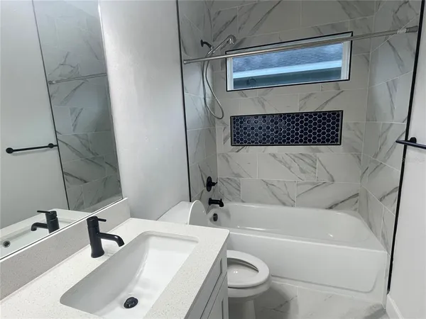a bathroom with a sink double vanity and a mirror