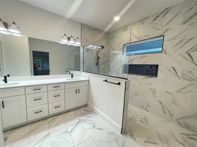 a bathroom with a sink a toilet and bathtub