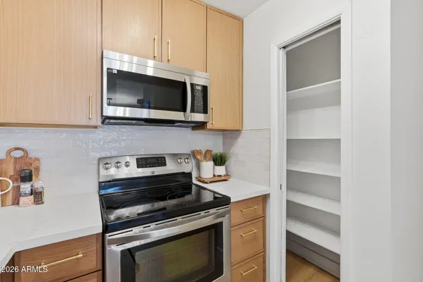 a kitchen with a stove and a microwave