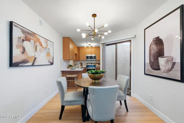 a dining room with furniture and window