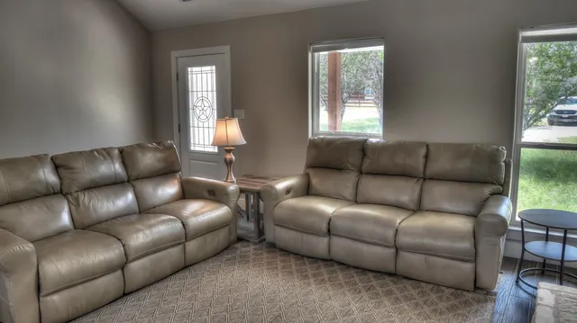 a living room with furniture and a window