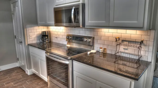 a kitchen with a sink and cabinets