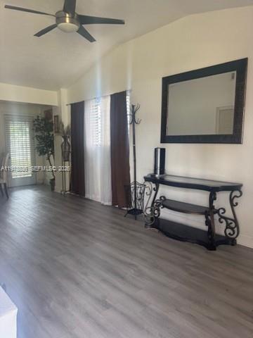 850 Northwest 84th Street Miami, FL 33150 - Photo 2 of 10 a view of an empty room with wooden floor and a chair