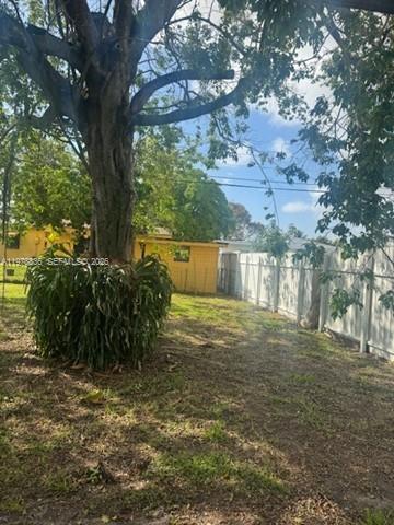 850 Northwest 84th Street Miami, FL 33150 - Photo 10 of 10 a backyard of a house with lots of green space