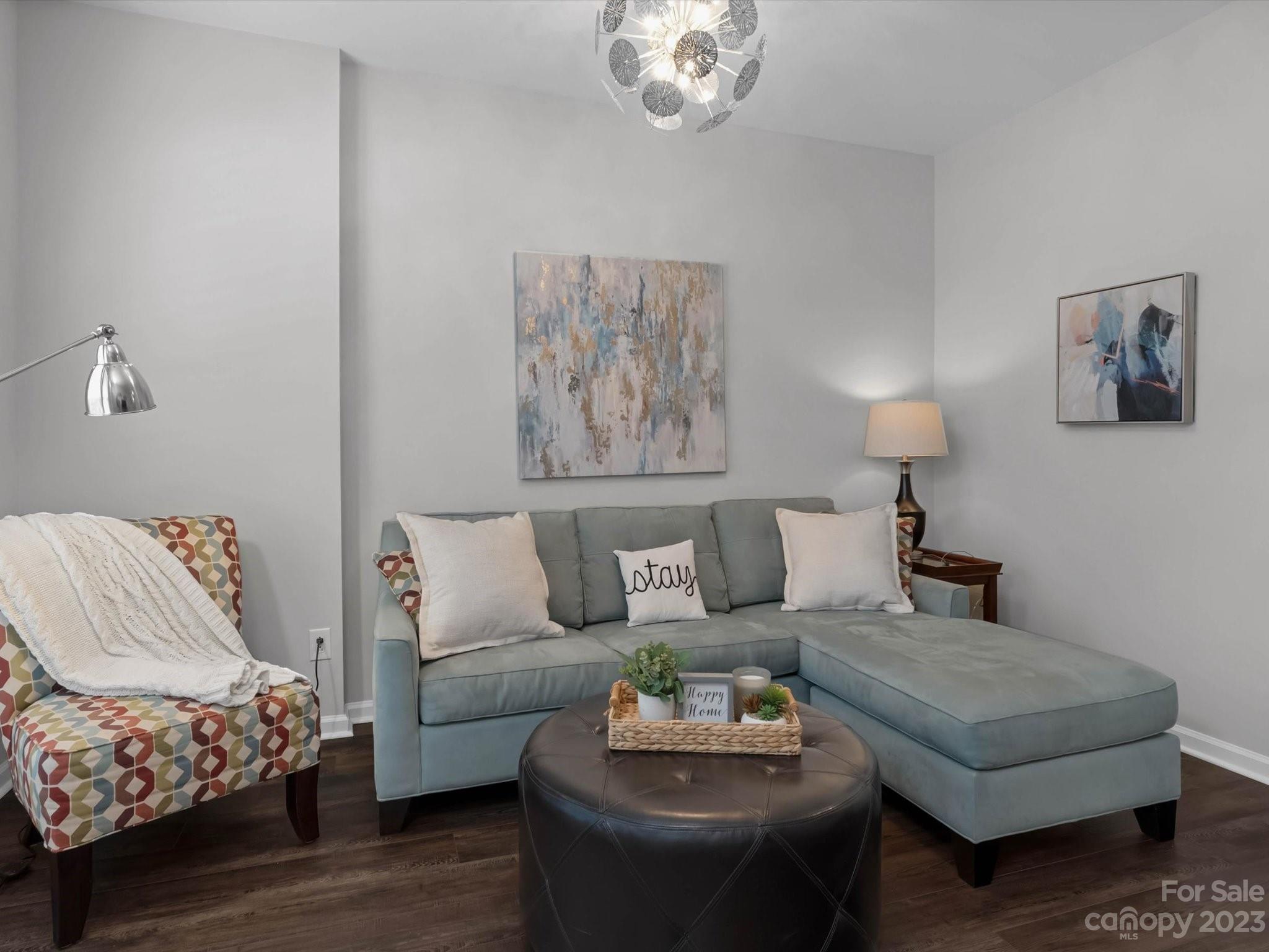 7902 Mariners Pointe Circle Denver, NC 28037 - Photo 8 of 42 a living room with furniture and a wooden floor