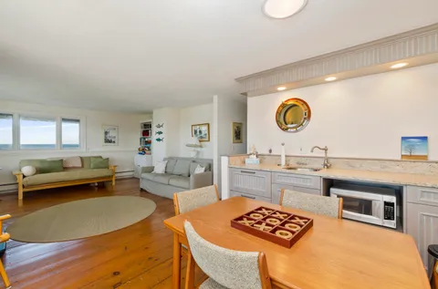 a kitchen with a table and chairs