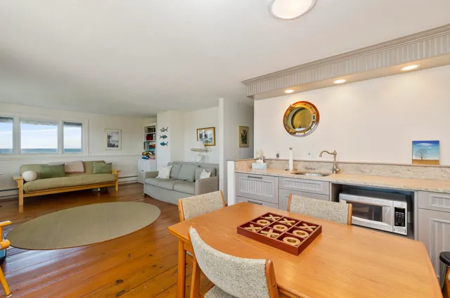 a kitchen with a table and chairs
