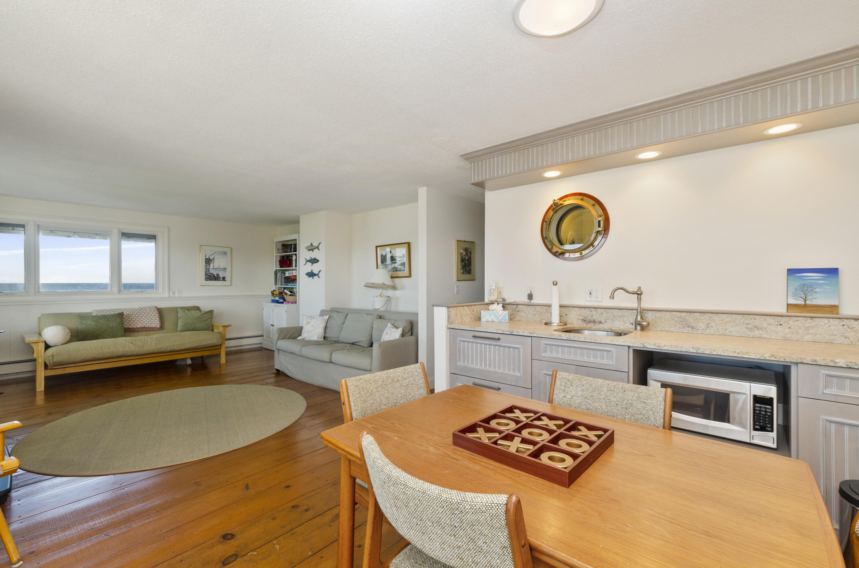 96 Shore Drive Dennis, MA 02638 - Photo 25 of 37 a living room with granite countertop furniture and a wooden floor