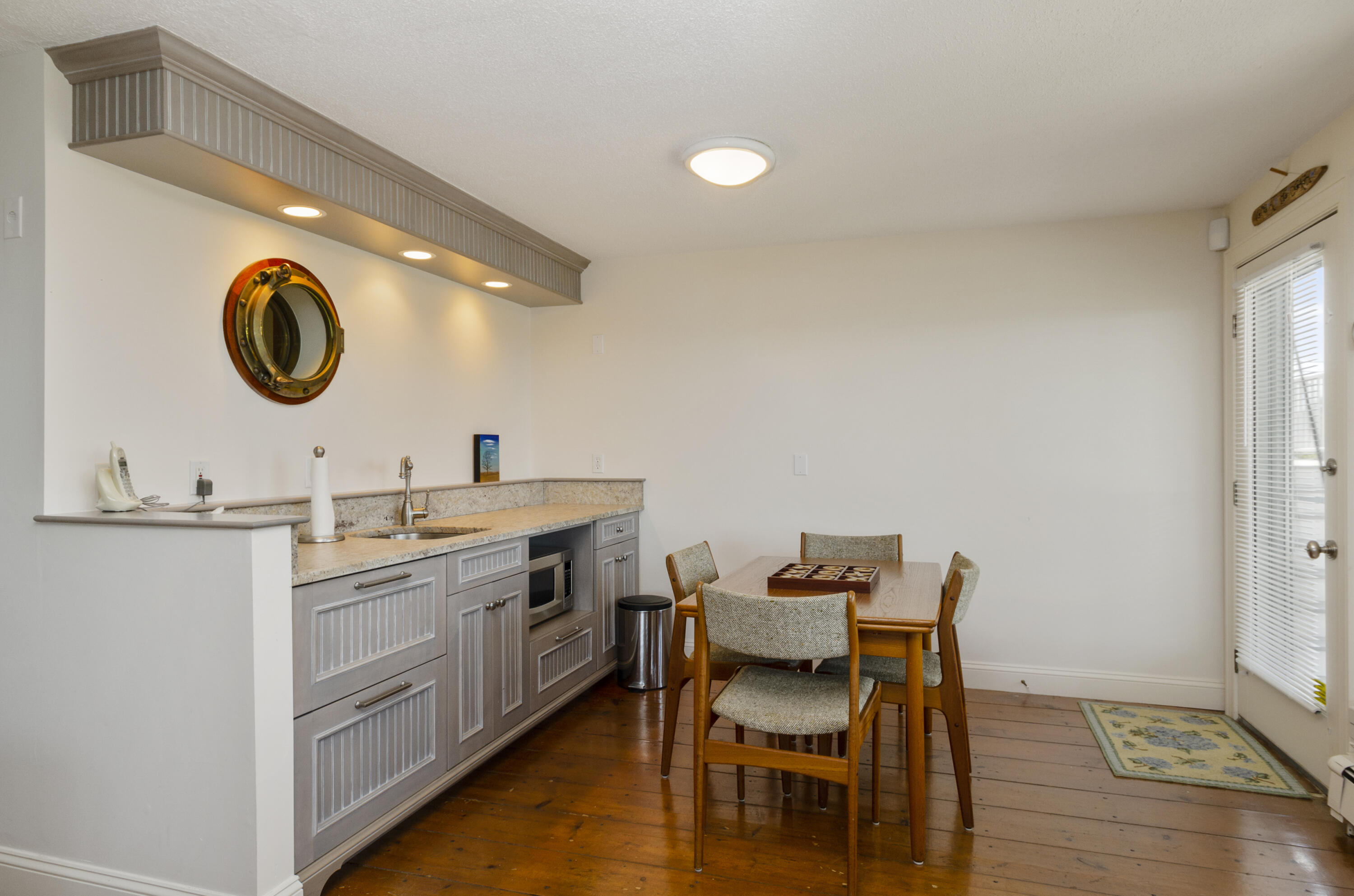 96 Shore Drive Dennis, MA 02638 - Photo 26 of 37 a kitchen with a table and chairs