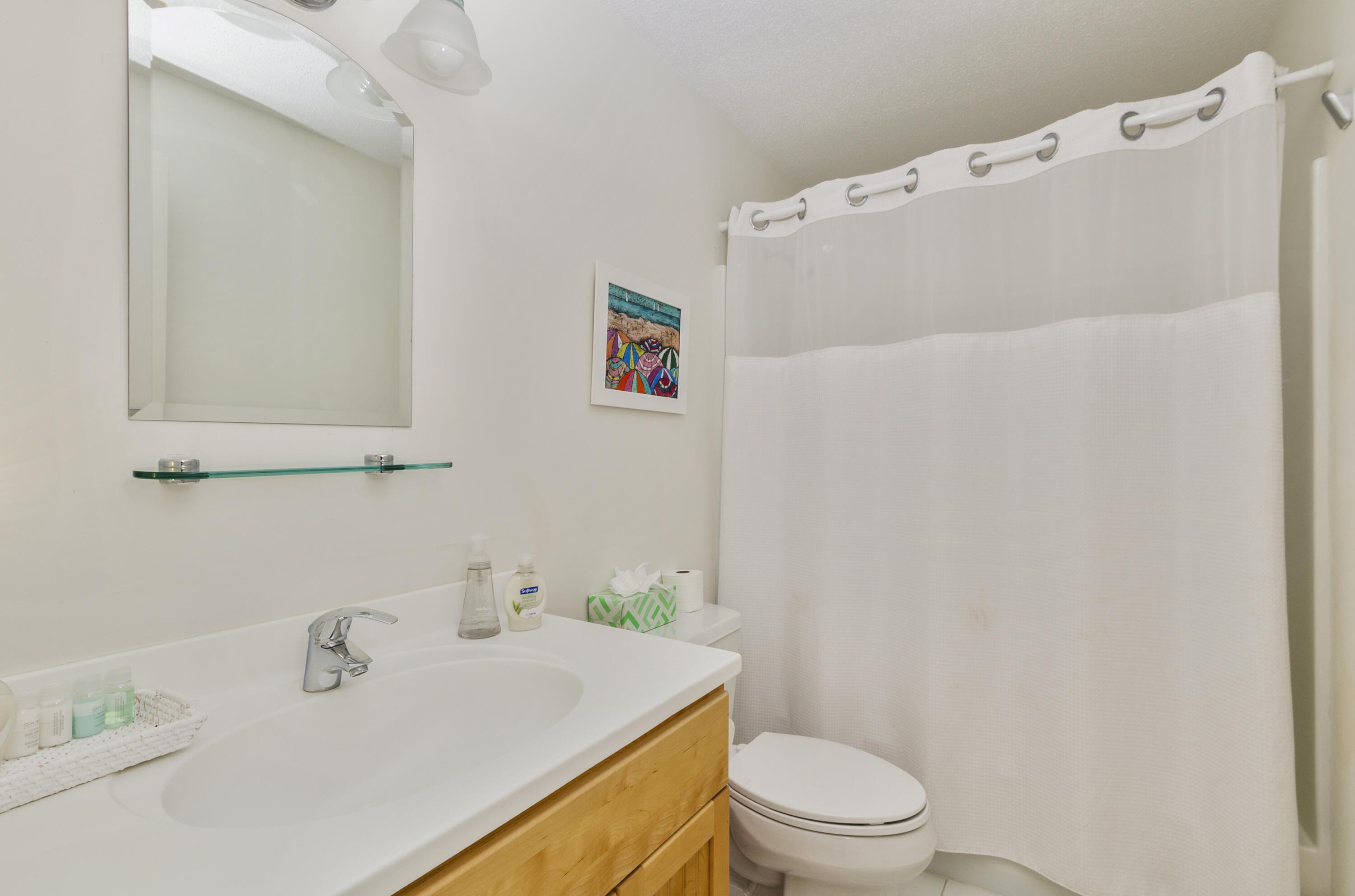 96 Shore Drive Dennis, MA 02638 - Photo 27 of 37 a white toilet sitting next to a bathroom sink