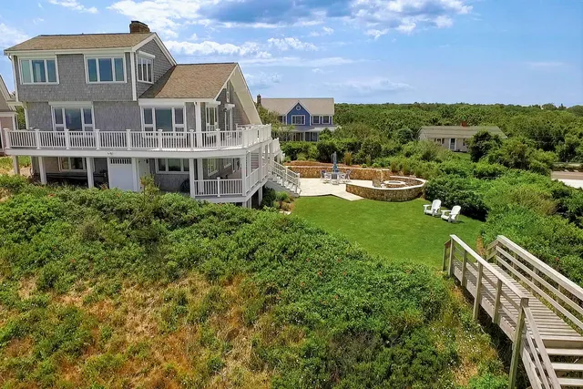 an aerial view of a house with outdoor space
