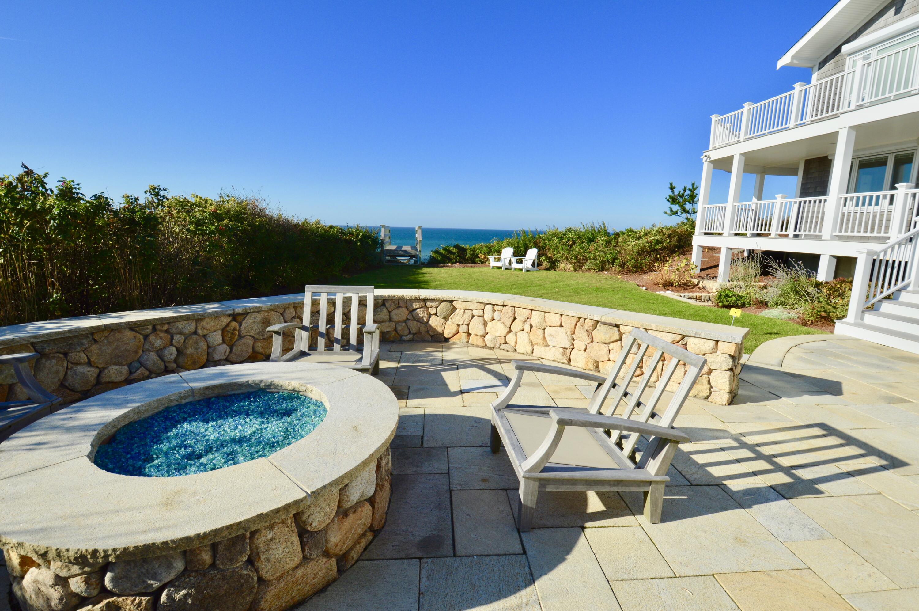 96 Shore Drive Dennis, MA 02638 - Photo 35 of 37 a view of a swimming pool with lounge chair