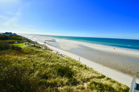 a aerial view of a house with table and chairs