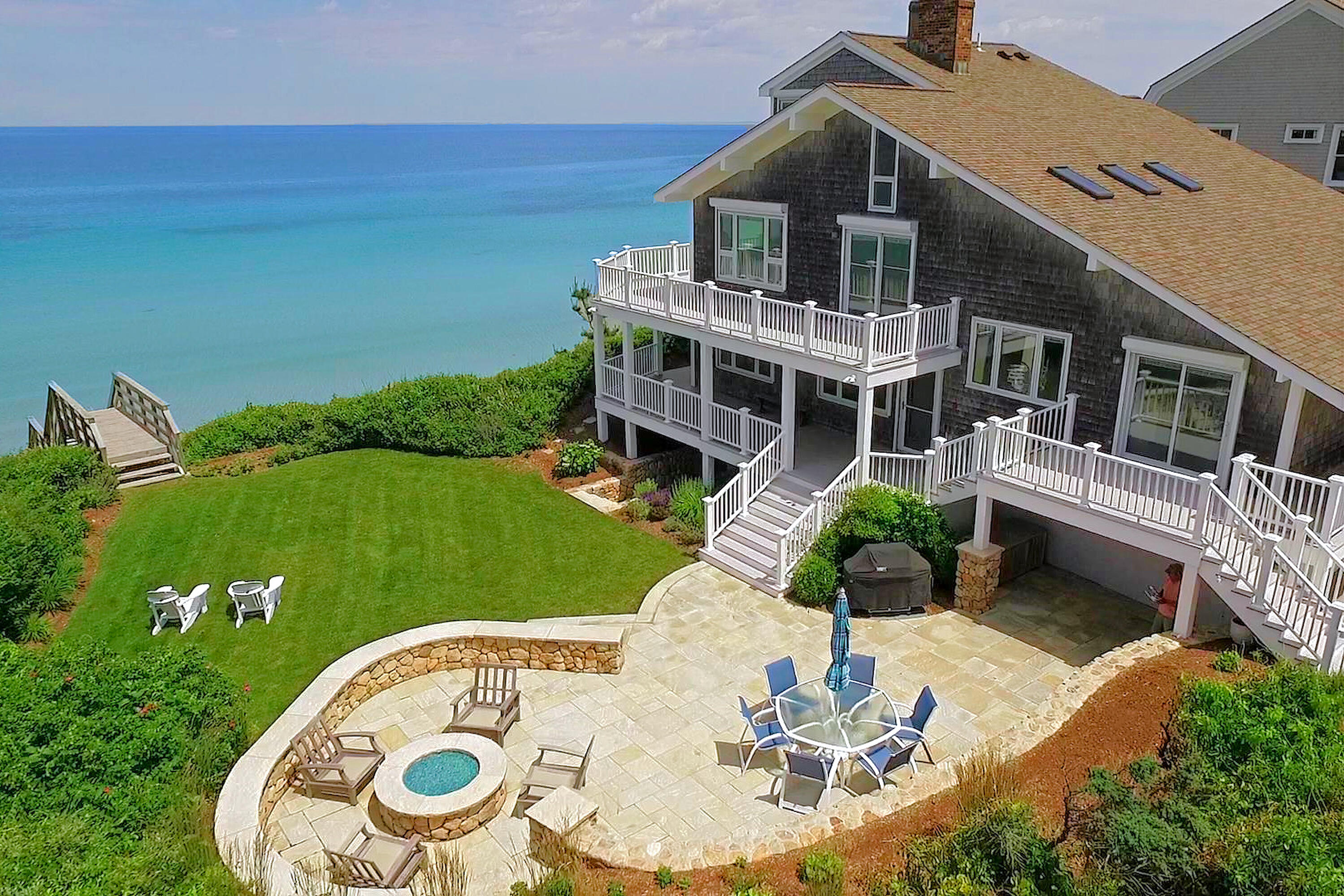 96 Shore Drive Dennis, MA 02638 - Photo 37 of 37 a aerial view of a house with table and chairs