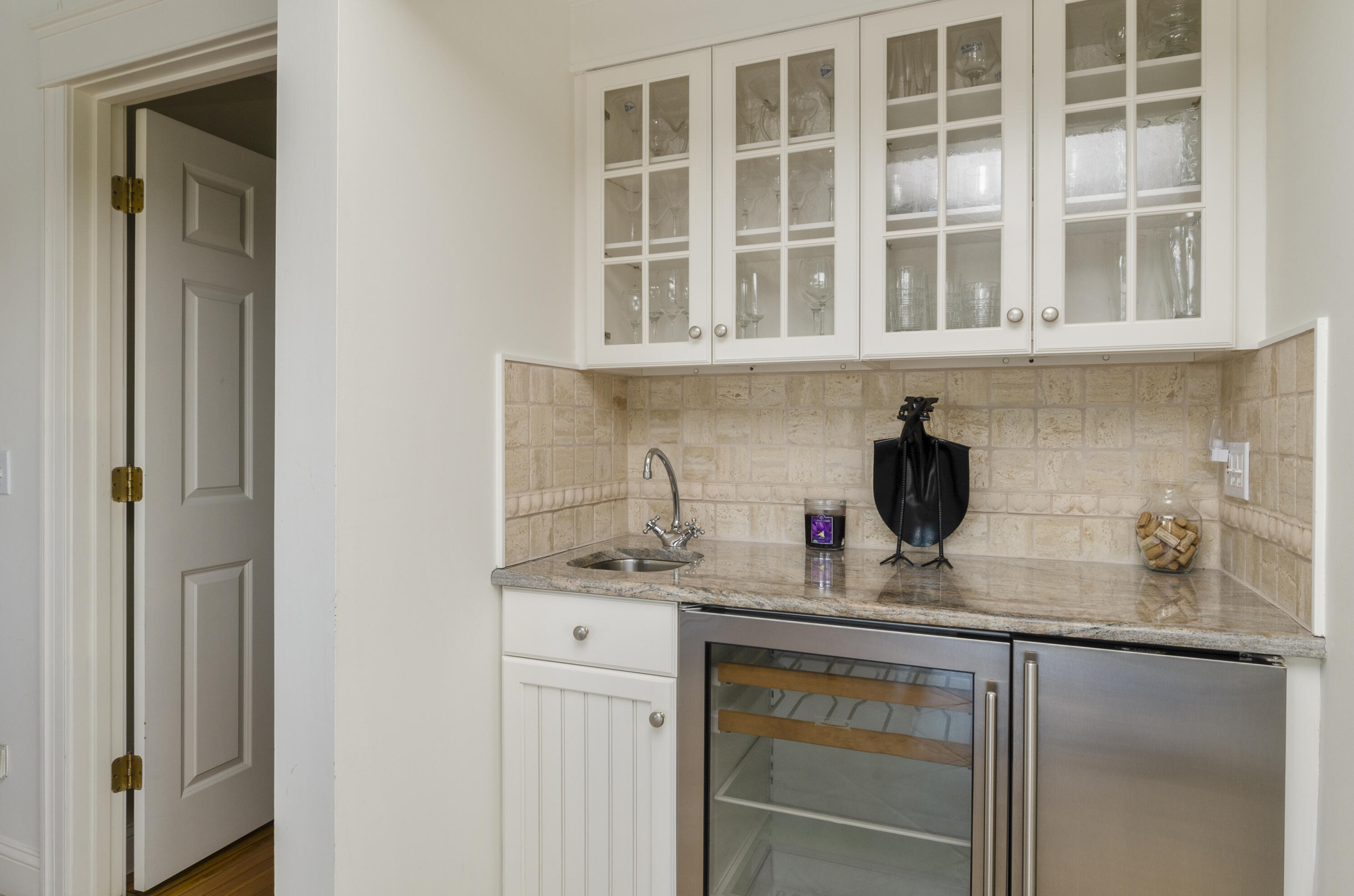 96 Shore Drive Dennis, MA 02638 - Photo 6 of 37 a kitchen with a sink and cabinets