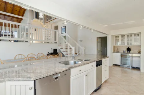 a view of a a dining room with furniture window and wooden floor