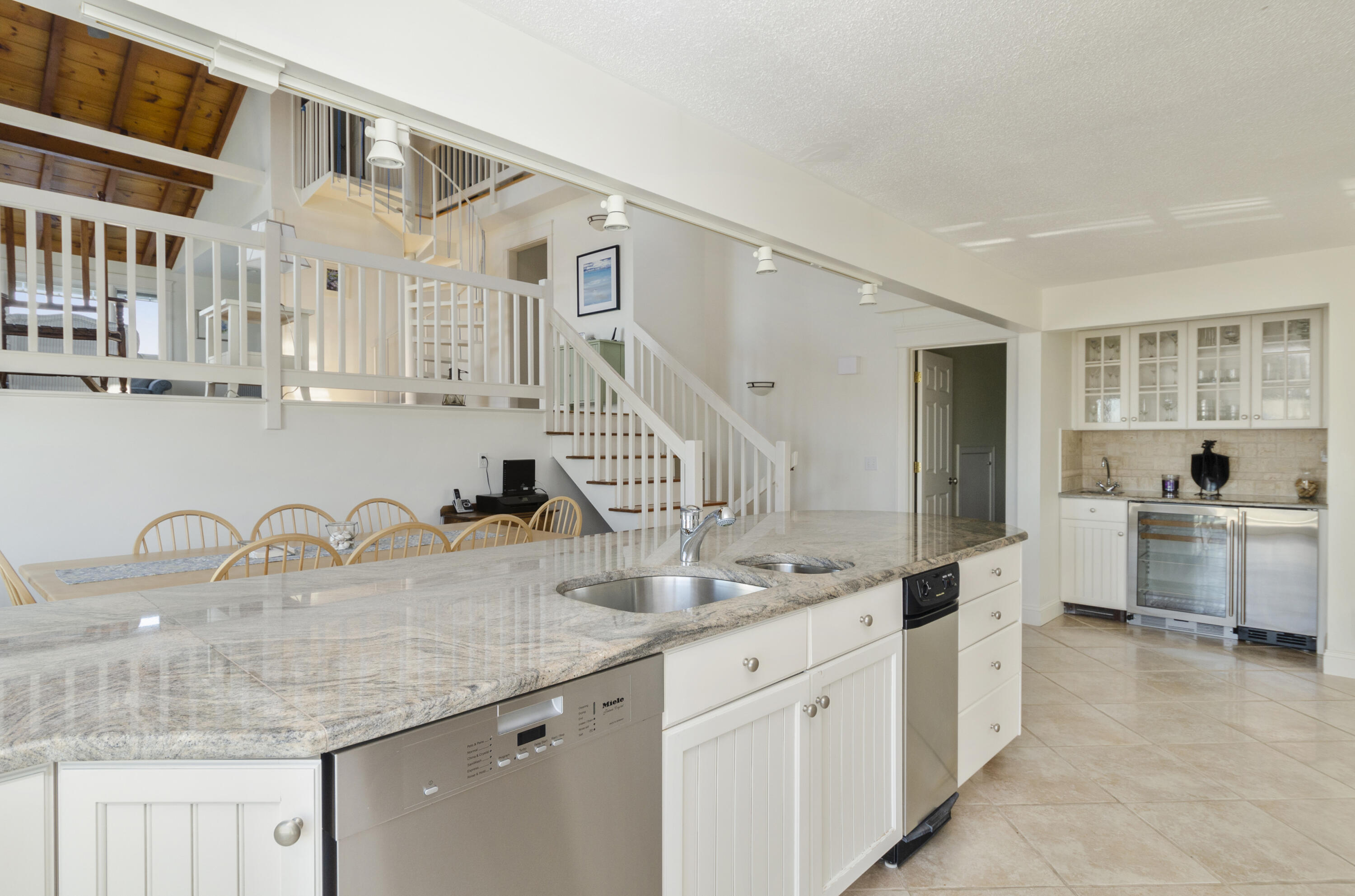 96 Shore Drive Dennis, MA 02638 - Photo 7 of 37 a kitchen with granite countertop a sink and cabinets