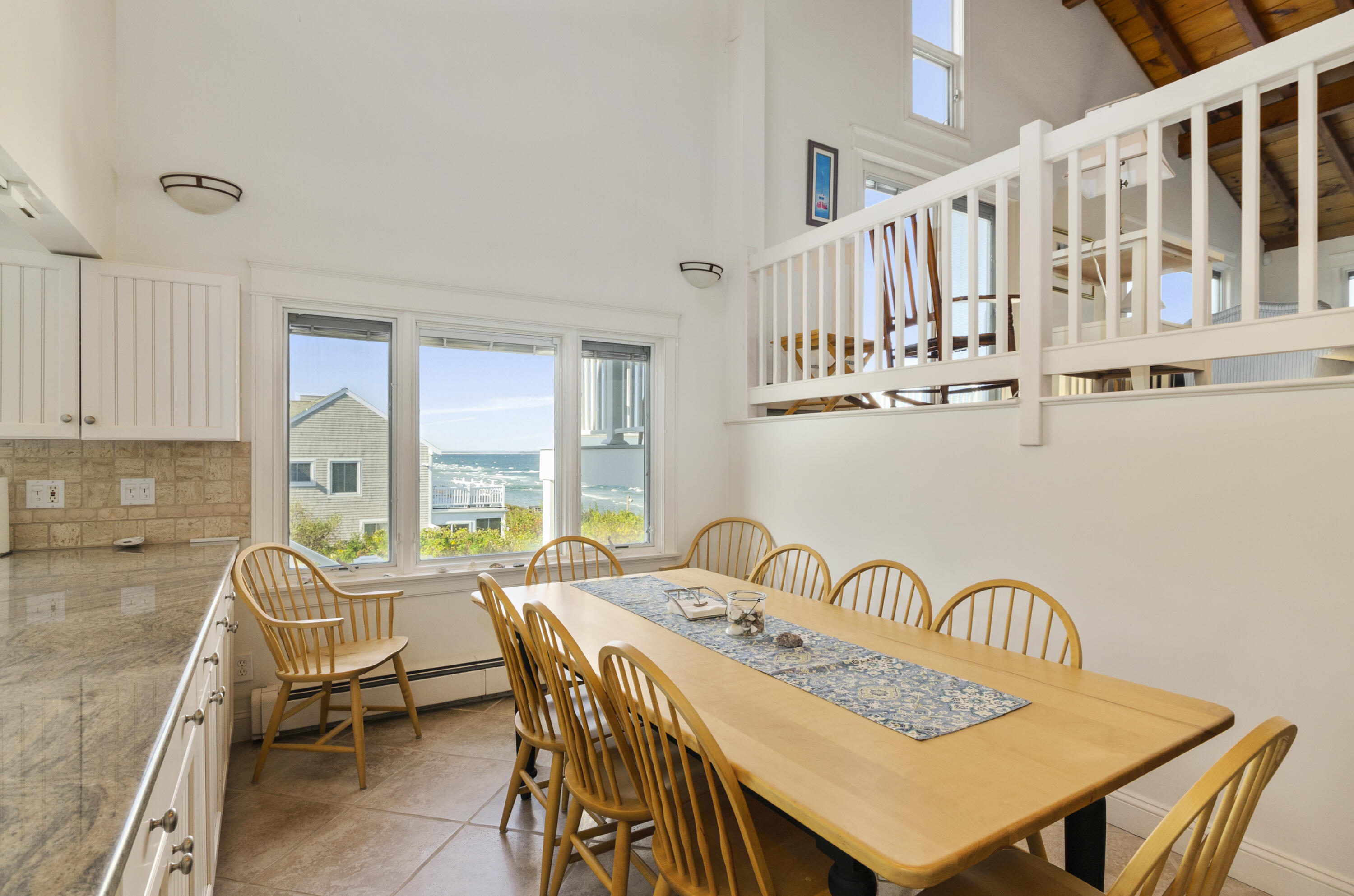 96 Shore Drive Dennis, MA 02638 - Photo 8 of 37 a view of a a dining room with furniture window and wooden floor