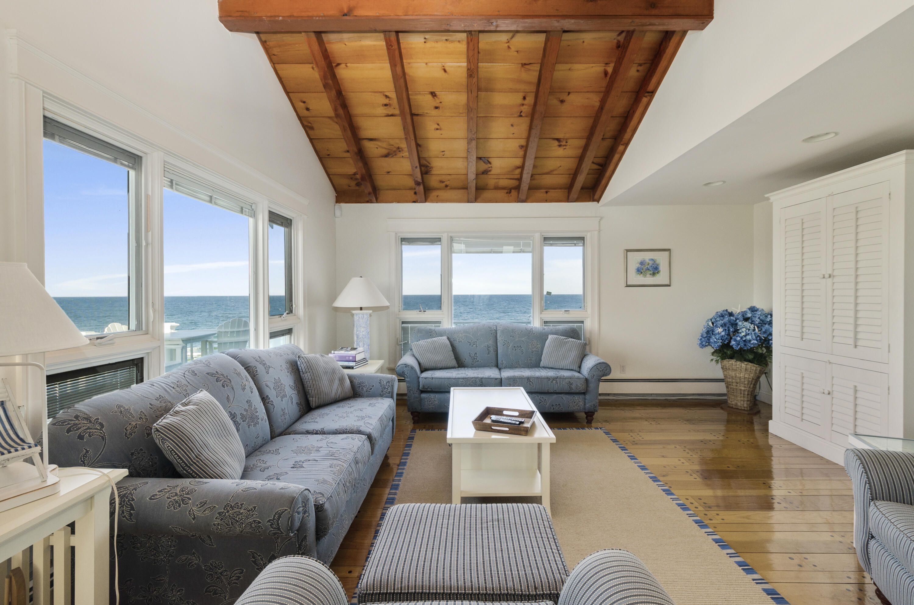 96 Shore Drive Dennis, MA 02638 - Photo 10 of 37 a living room with furniture and a large window