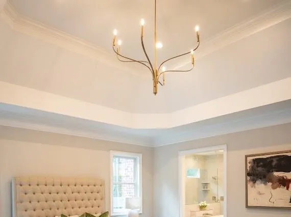 a kitchen with a table chairs and wooden floor