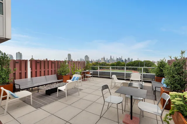 a view of a terrace with chairs and a couch