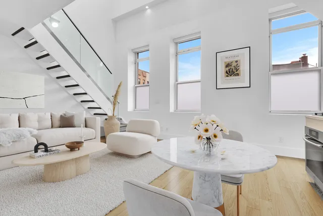 a black and white photo of a white wall