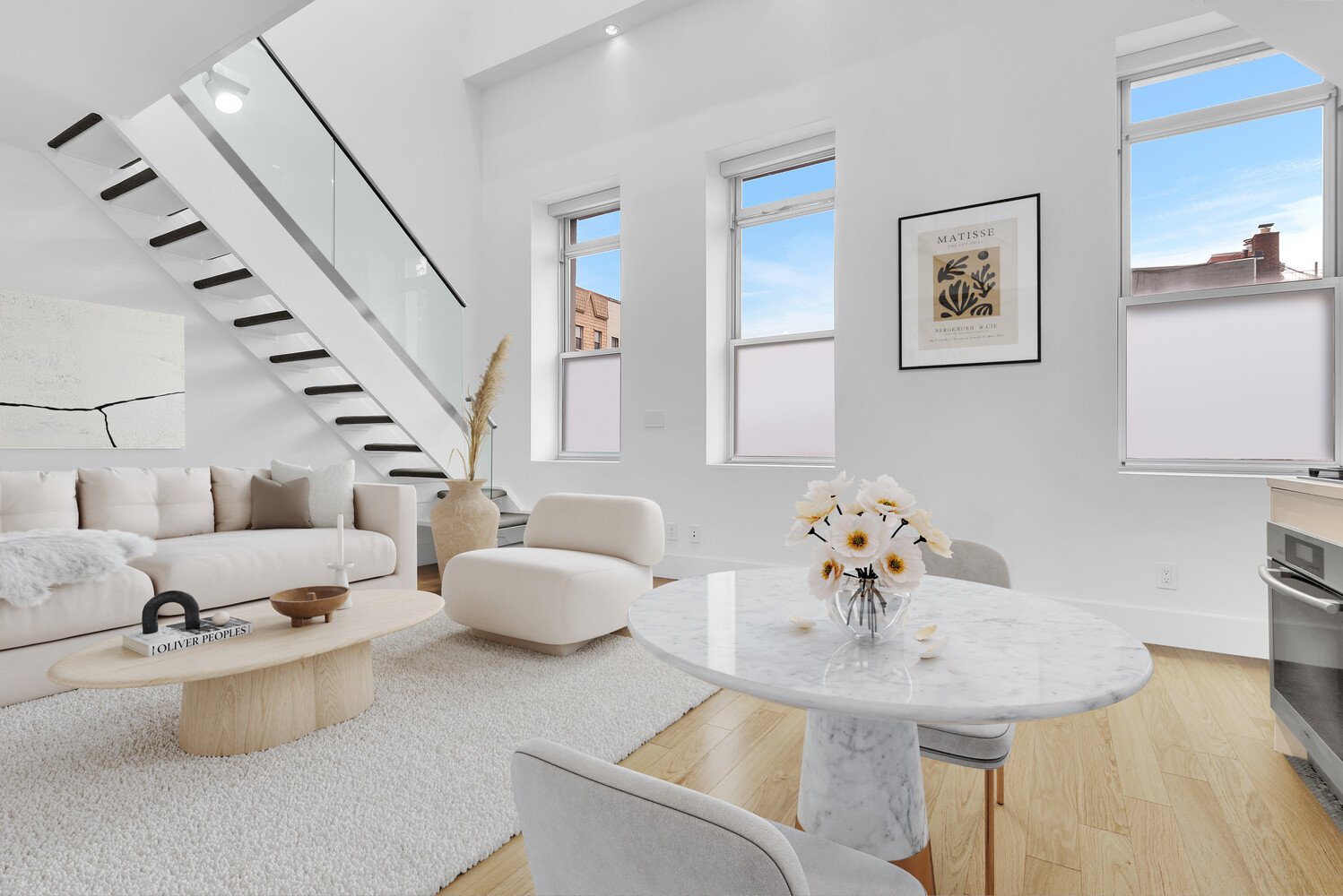 a dining room with furniture and wooden floor