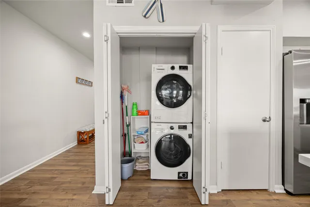 a view of a hallway with washer and dryer