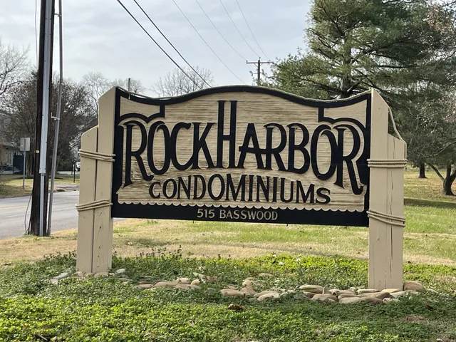 an empty room with wooden floor and door