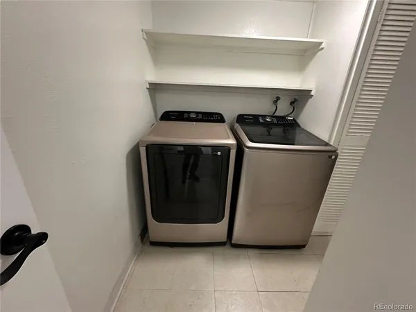 a utility room with washing machine