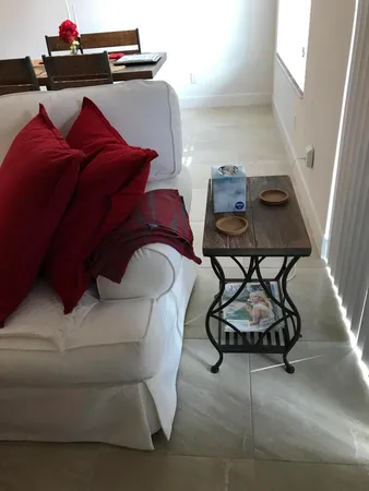 a living room with a couch and white walls