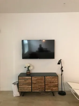 a living room with a flat screen tv