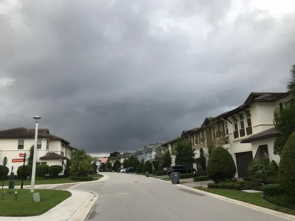 a view of a street with a building in the background