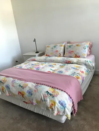 a bedroom with a bed and a table