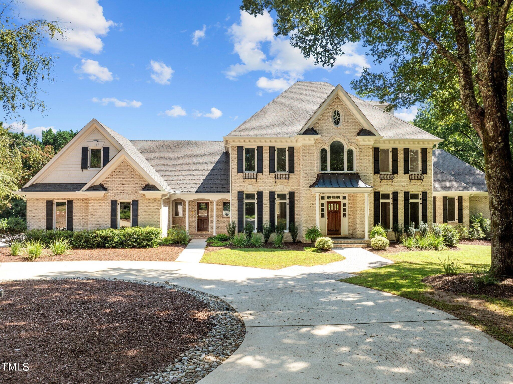 1609 Old Keith Road Wake Forest, NC 27587 - Photo 1 of 81 a front view of a house with a yard in front of it