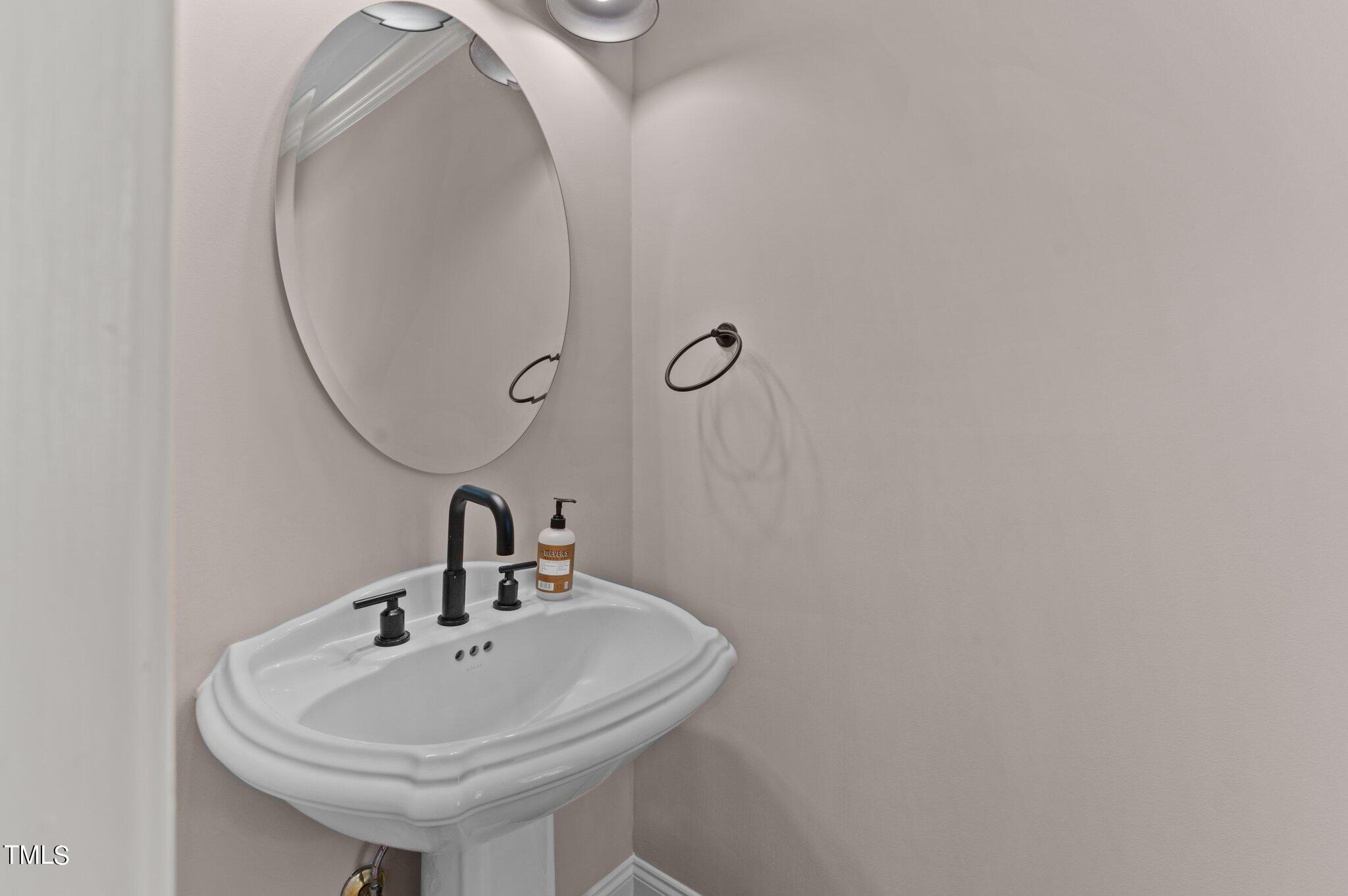 1609 Old Keith Road Wake Forest, NC 27587 - Photo 26 of 81 a bathroom with a sink and a mirror