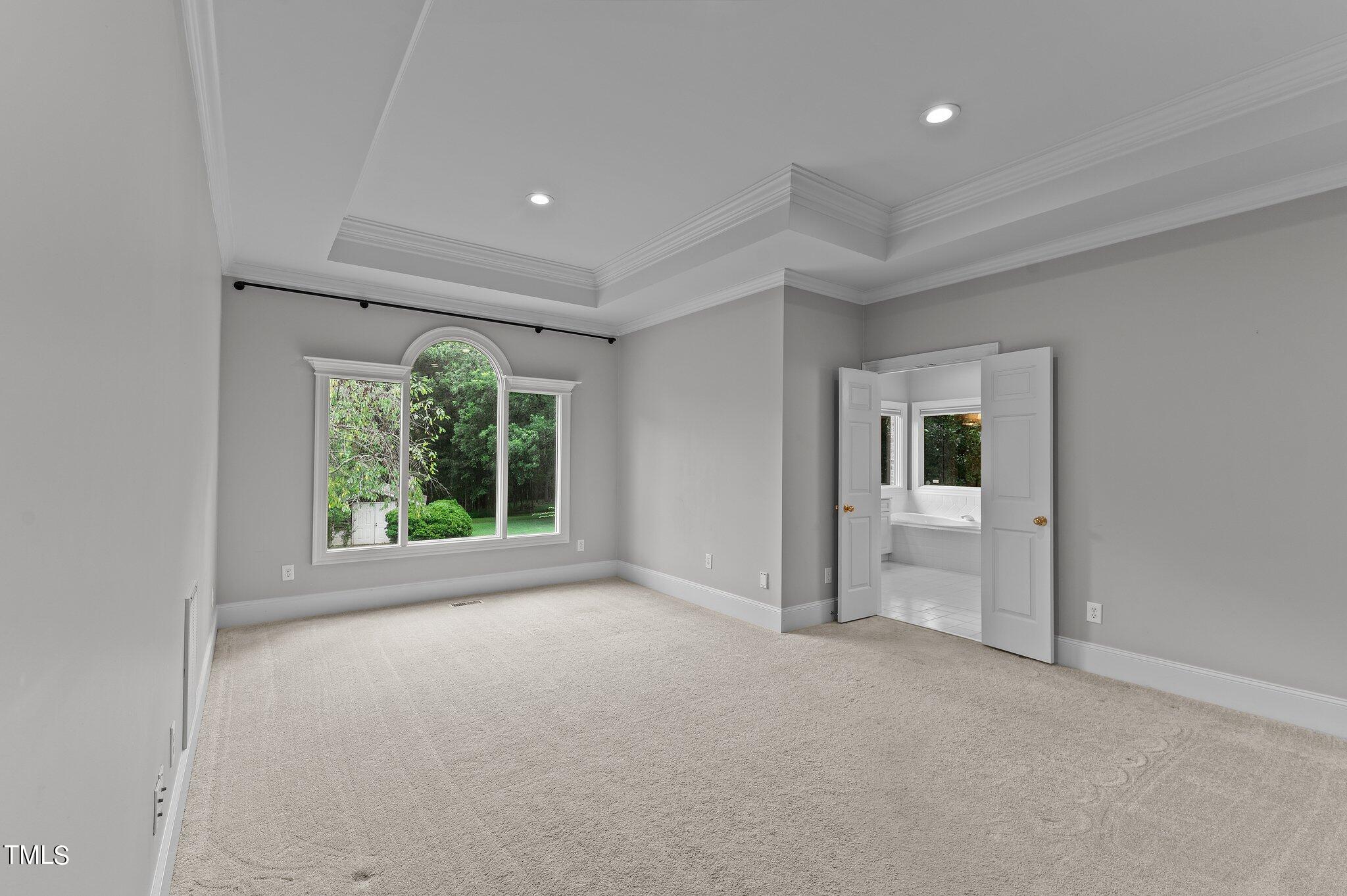 1609 Old Keith Road Wake Forest, NC 27587 - Photo 30 of 81 a view of empty room with window and ceiling fan