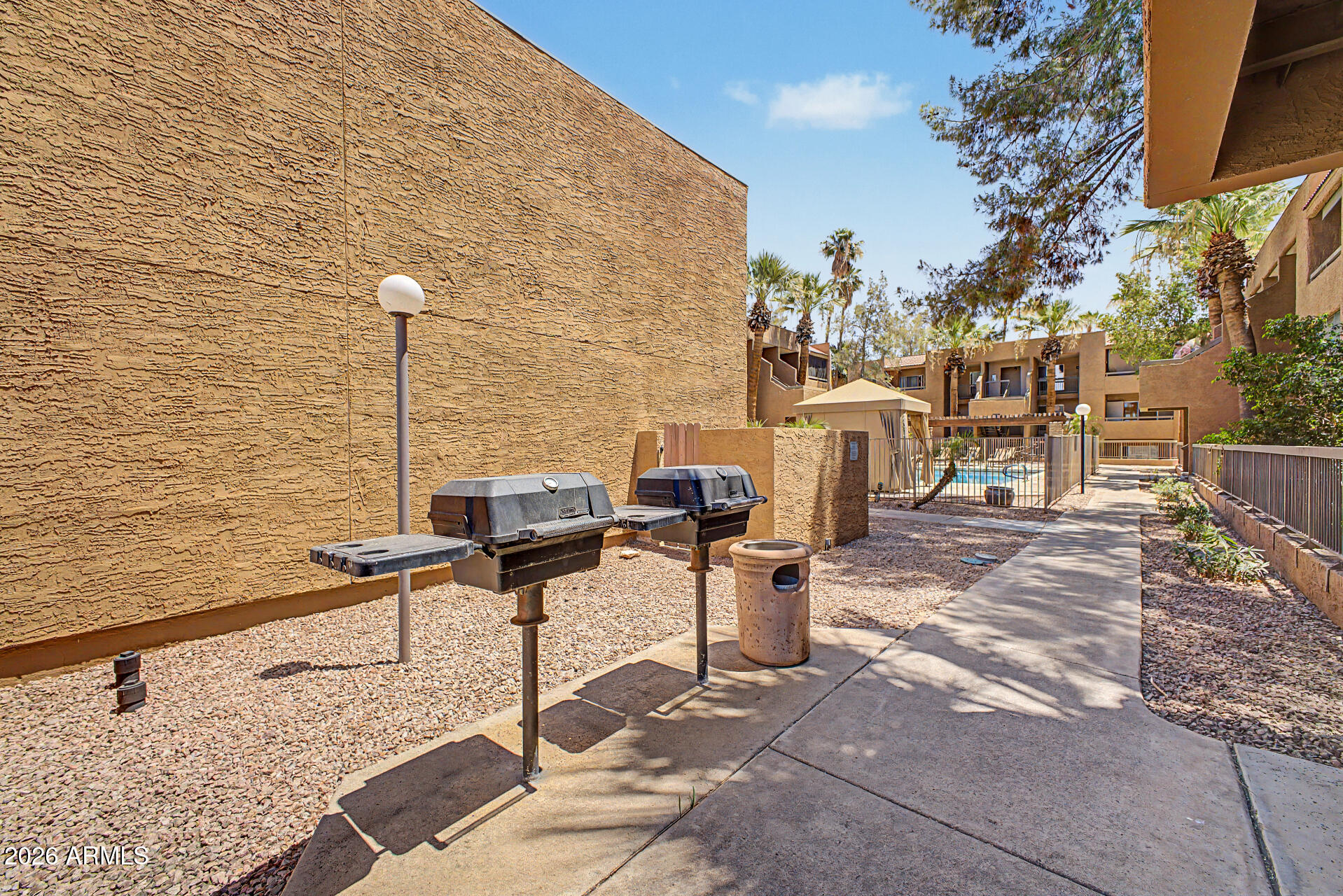 2625 East Indian School Road, Unit 227 Phoenix, AZ 85016 - Photo 24 of 31 a view of a terrace with chairs