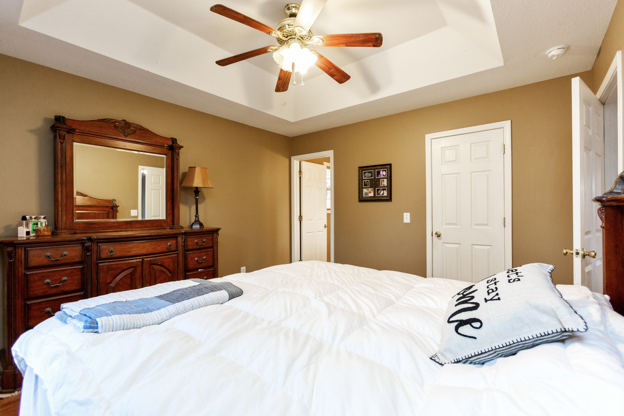 4382 Airport Road Springfield, TN 37172 - Photo 13 of 31 a bedroom with a large bed and a mirror on dresser