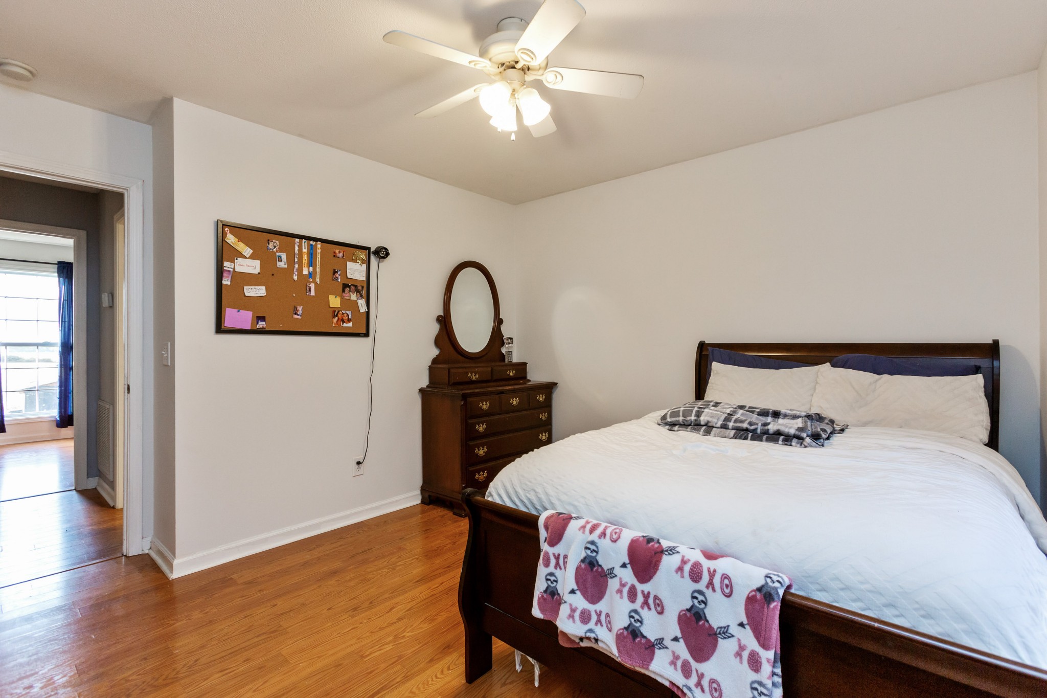 4382 Airport Road Springfield, TN 37172 - Photo 16 of 31 a bedroom with a bed and a chandelier