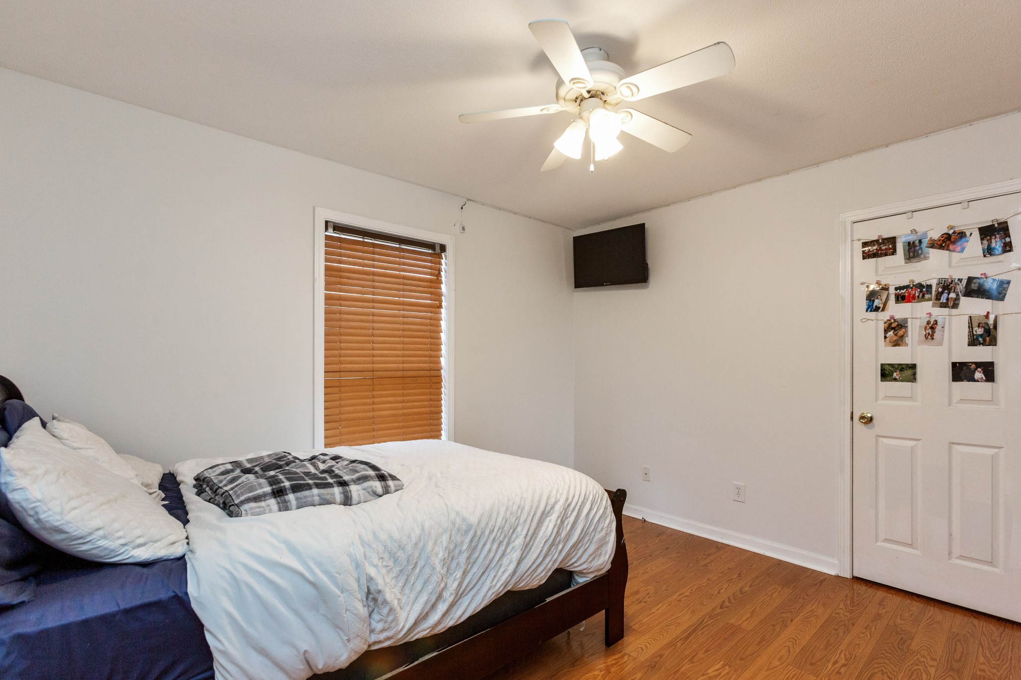 4382 Airport Road Springfield, TN 37172 - Photo 17 of 31 a bedroom with a bed and a chandelier