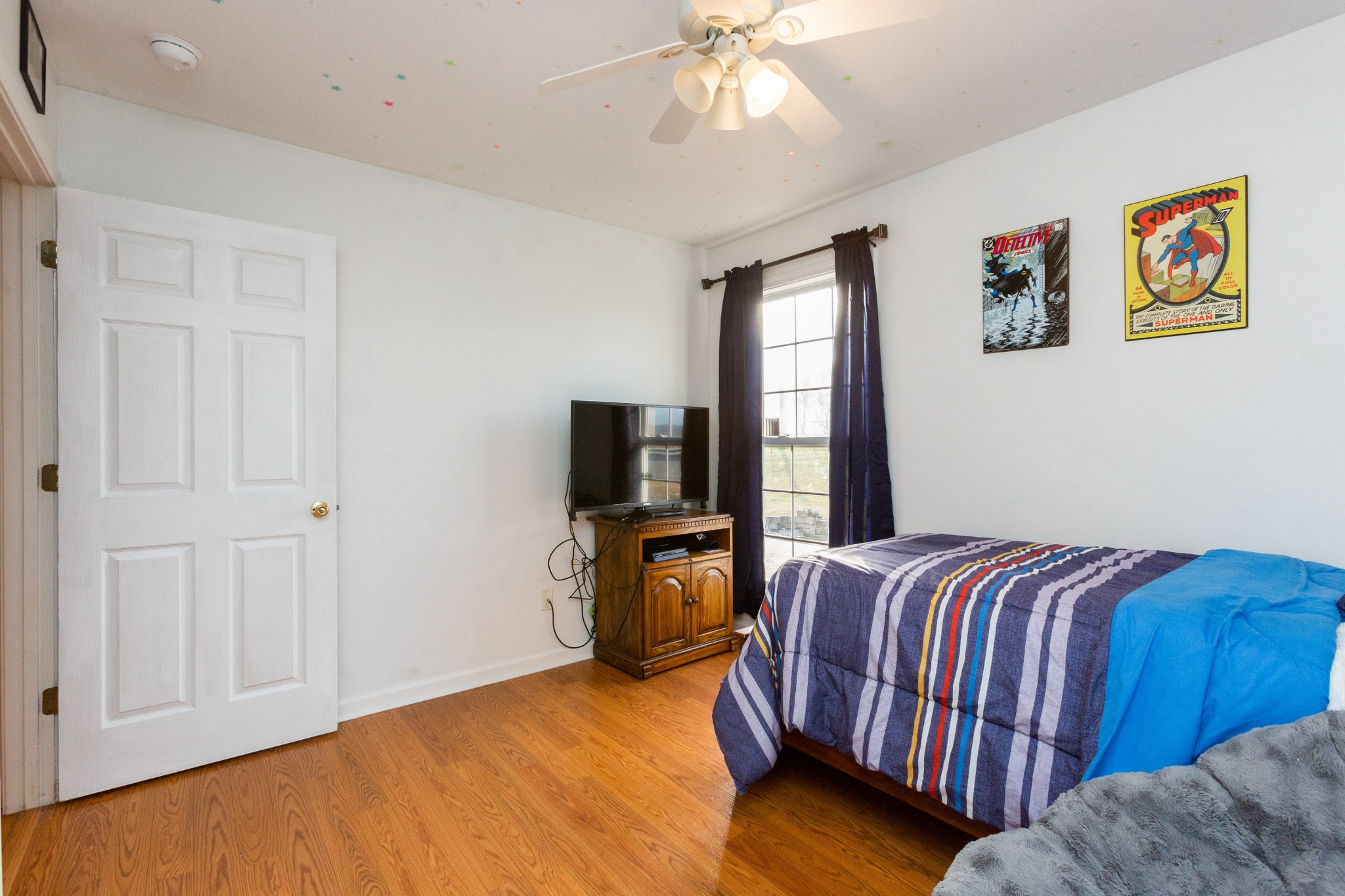 4382 Airport Road Springfield, TN 37172 - Photo 21 of 31 a bedroom with a bed and wooden floor