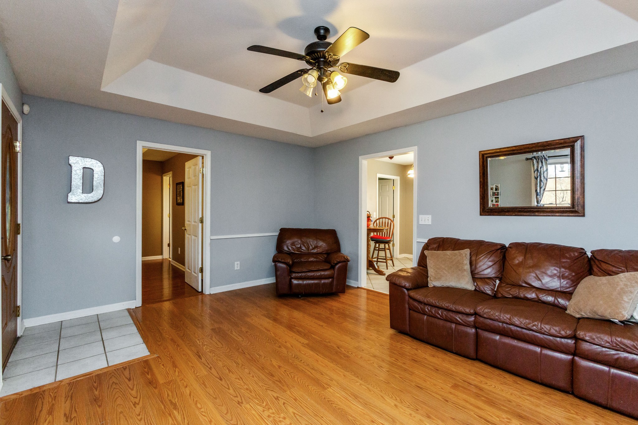 4382 Airport Road Springfield, TN 37172 - Photo 5 of 31 a living room with furniture and a chandelier
