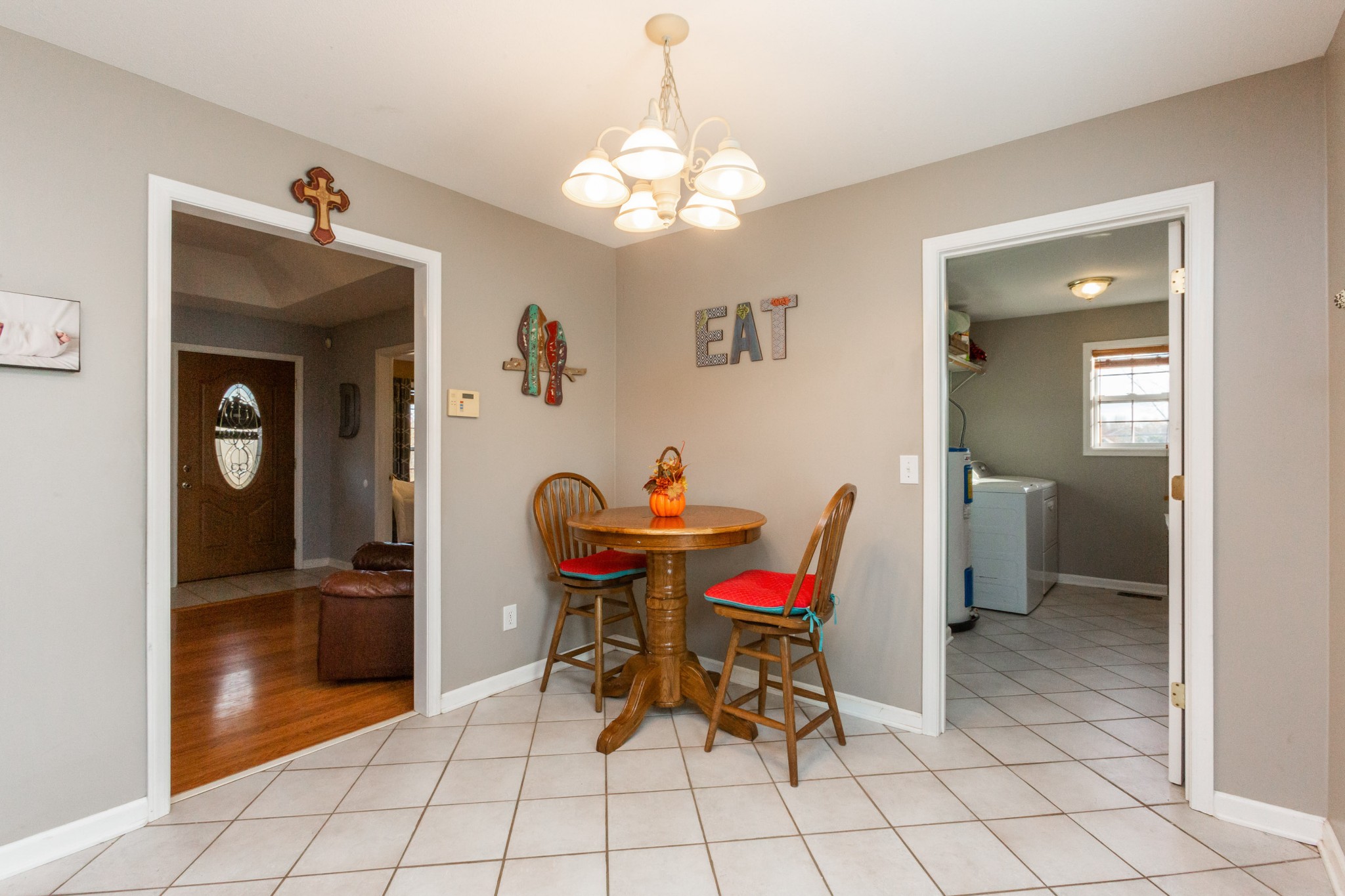 4382 Airport Road Springfield, TN 37172 - Photo 6 of 31 a view of a dining room with furniture and chandelier