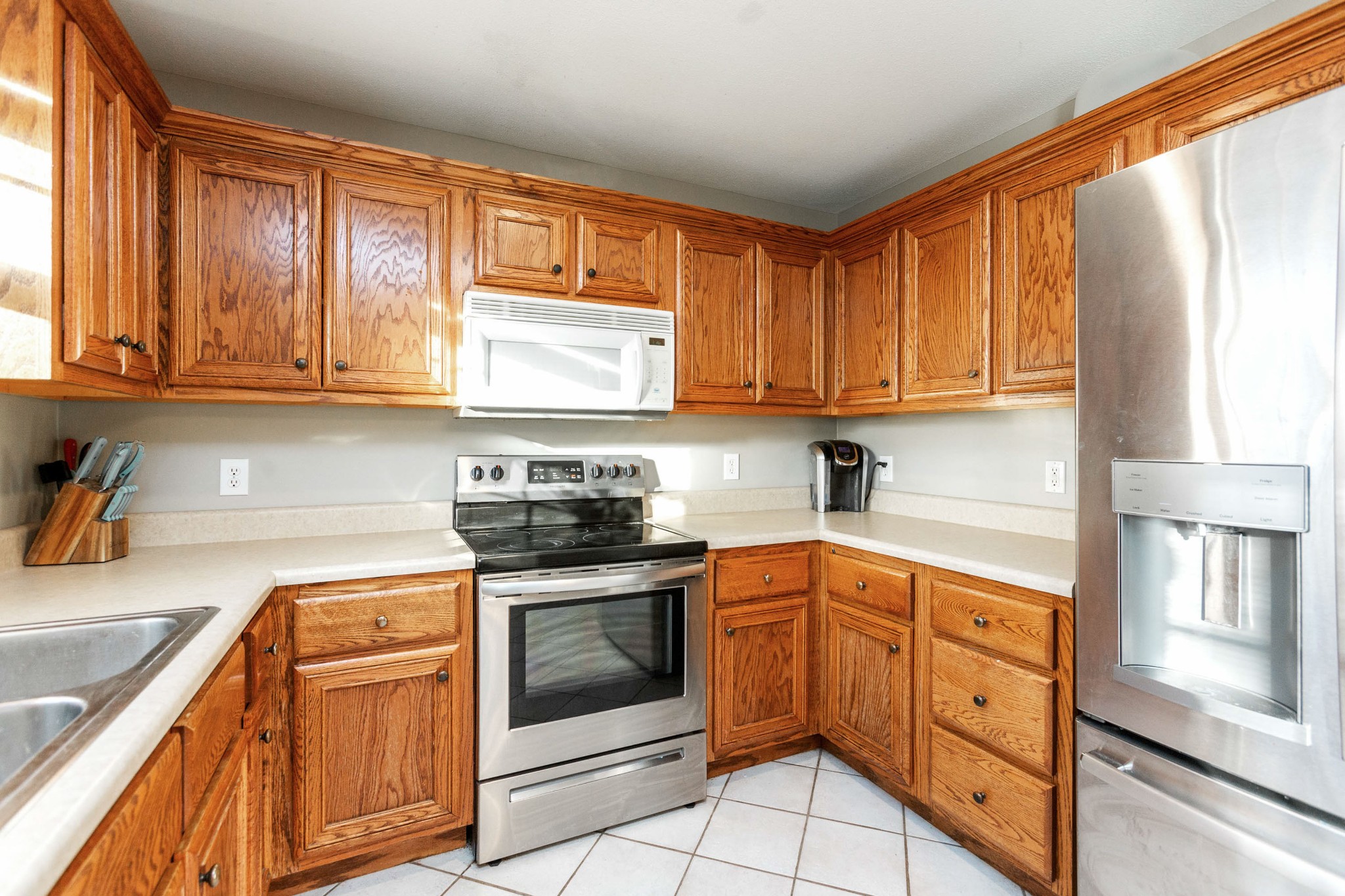 4382 Airport Road Springfield, TN 37172 - Photo 7 of 31 a kitchen with stainless steel appliances granite countertop a stove sink and cabinets