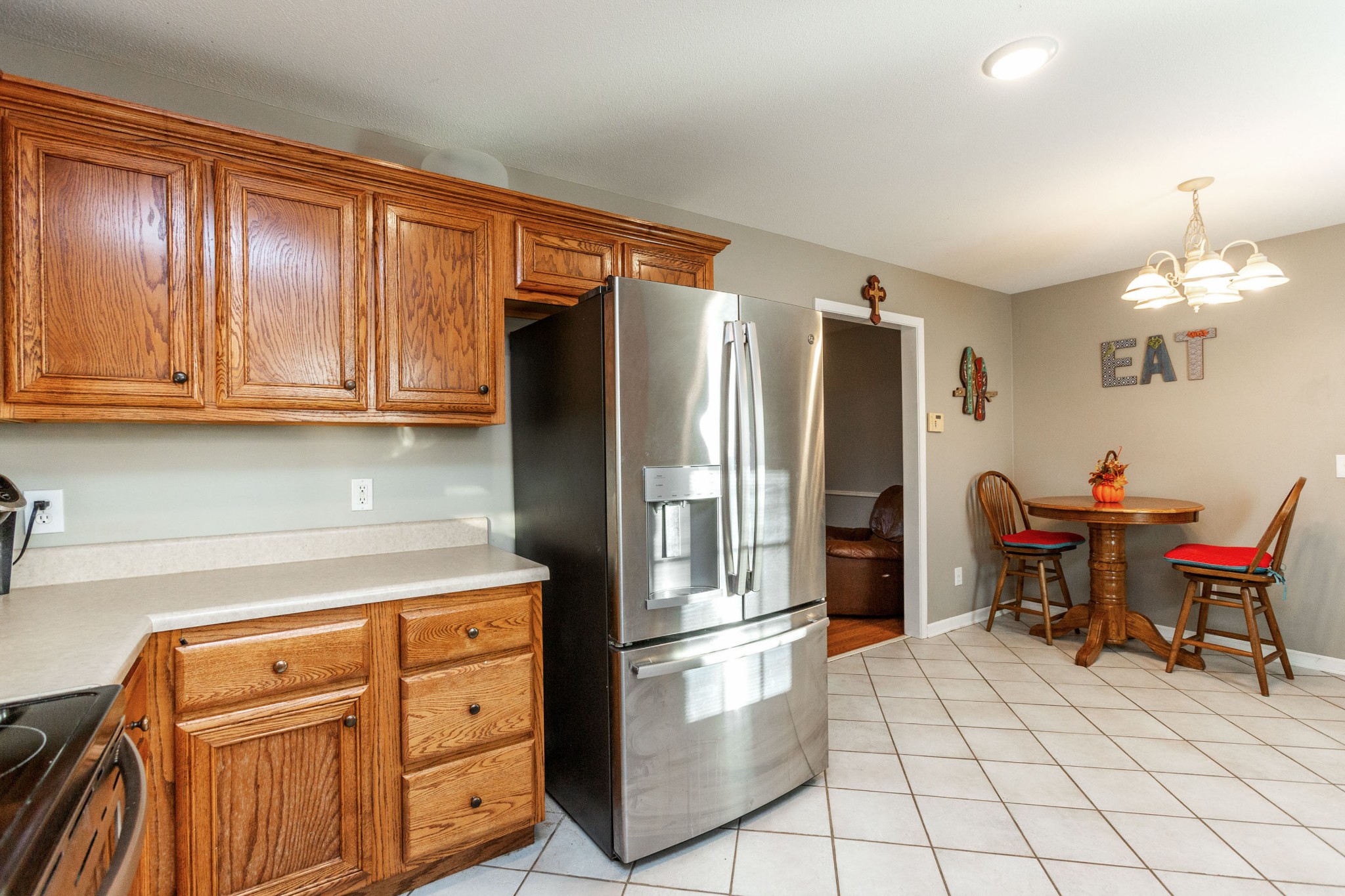 4382 Airport Road Springfield, TN 37172 - Photo 8 of 31 a kitchen with stainless steel appliances granite countertop a refrigerator and a stove top oven